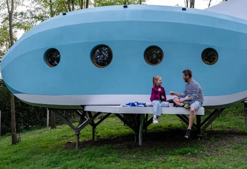 An airplane-shaped tiny home built from the Woods' in the Woods